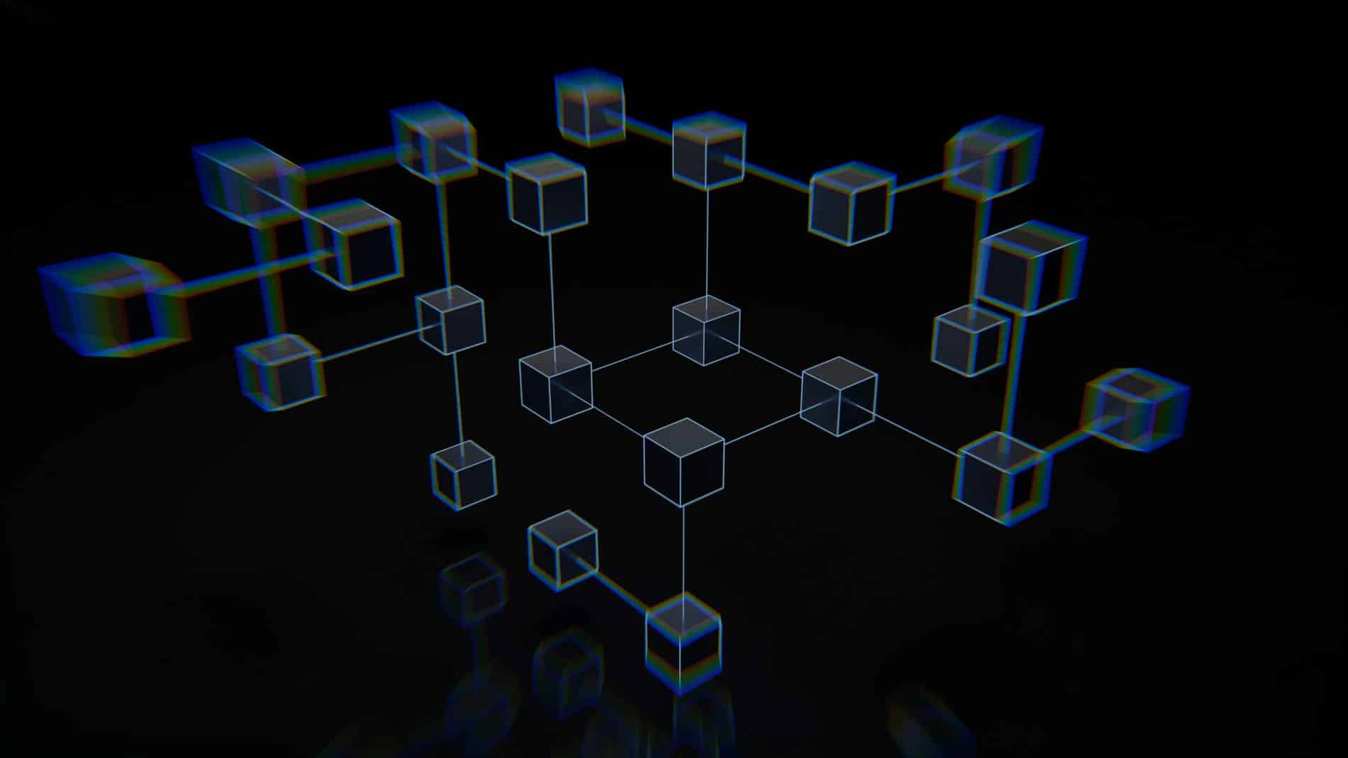 A group of interconnected cubes that are on a black surface.