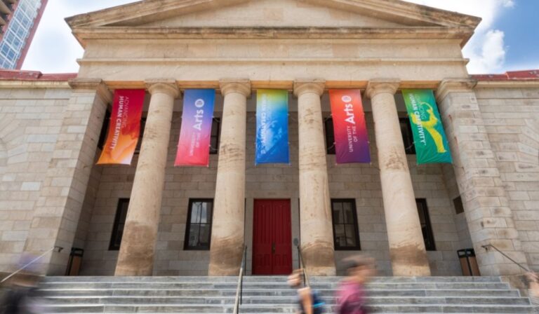 University of the Arts building with rainbow colored banners hanging down.